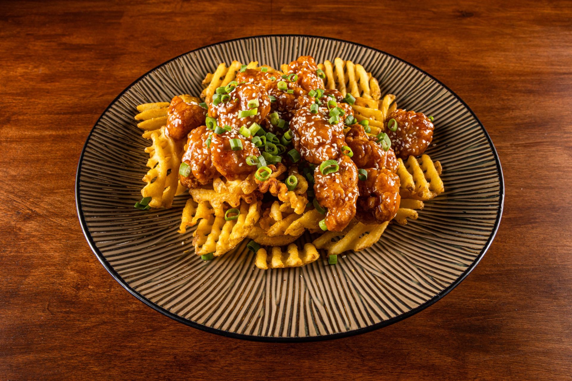 East Meets West: Orange Chicken and Waffle Fries - Potatoes USA